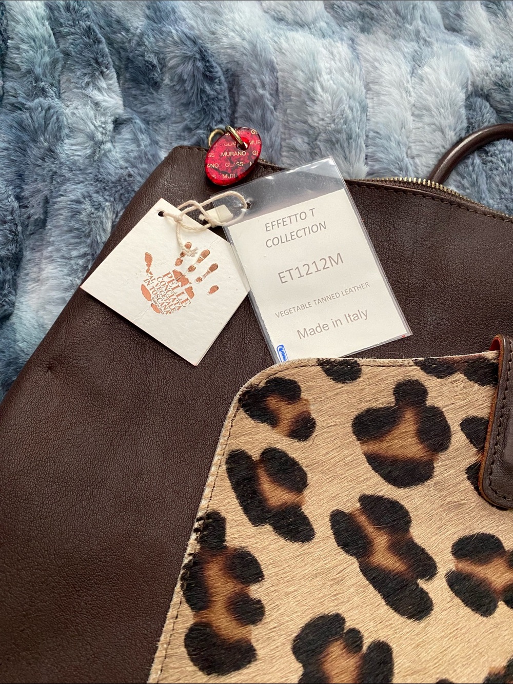Brown Leather Backpack with Leopard Haircalf Front & Murano details in zipper.